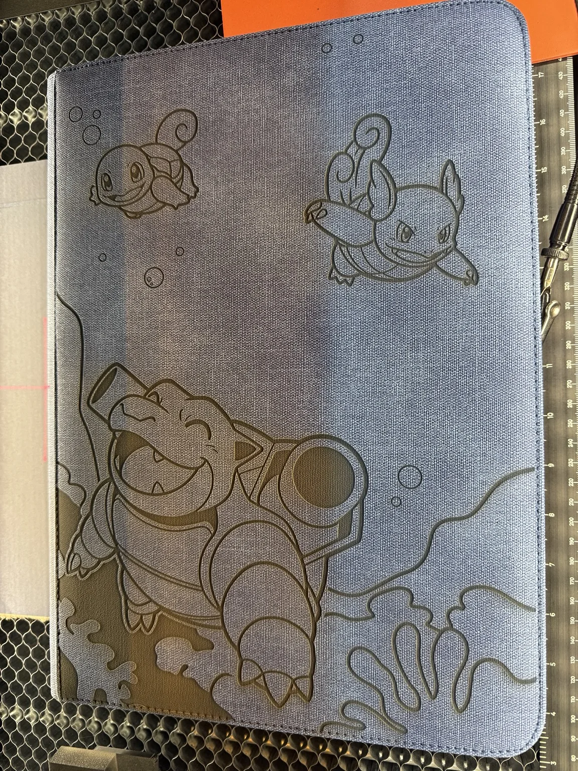 Custom laser engraved binder artwork