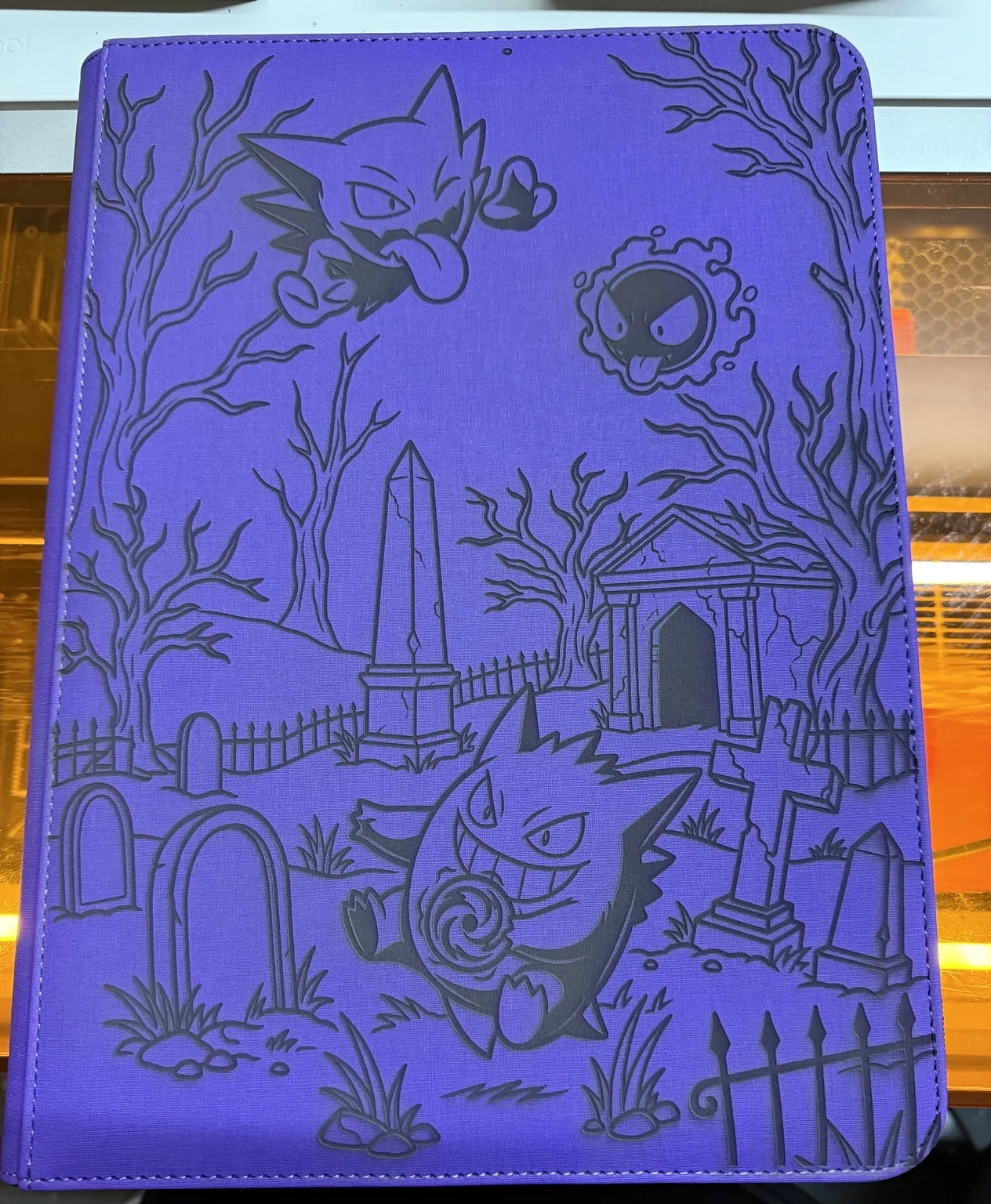 Custom laser engraved binder artwork